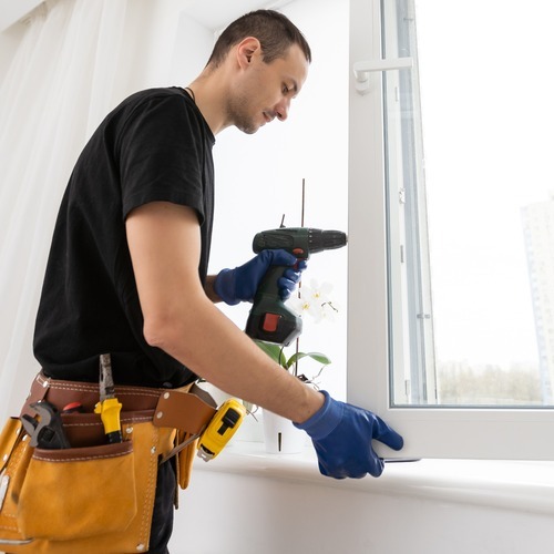 worker providing window repair