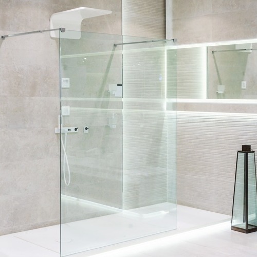 a shower with frameless glass doors
