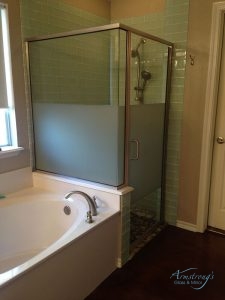 A Picture of a White Bathtub and Glass Shower.