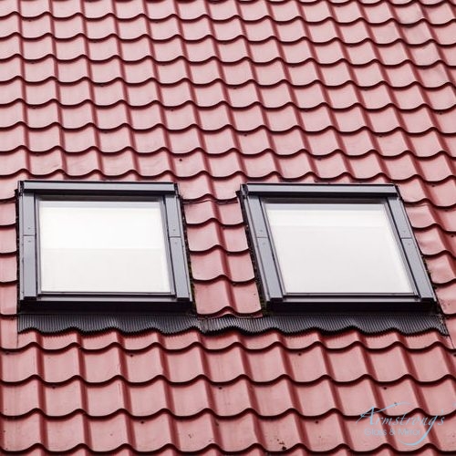 New red metal roof with skylights