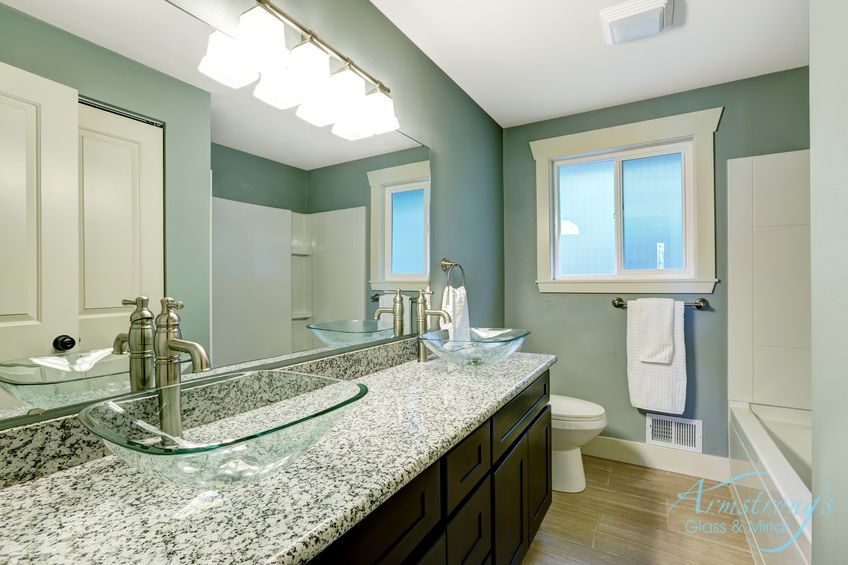 A Picture of a Wooden Vanity with Granite Countertop.